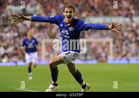 Everton's Nikica Jelavic celebrates sunderlands own goal after his shot during the FA Cup Sixth Round Replay at the Stadium of Light, Sunderland. Stock Photo