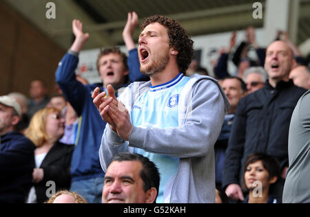 Soccer - npower Football League Championship - Hull City v Coventry City - KC Stadium. A Coventry City fan shows his support in the stands Stock Photo