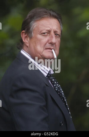 Eric Bristow arrives at the funeral of former world champion darts player Jocky Wilson at Kirkcaldy Crematorium in Scotland. Stock Photo