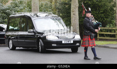 The hearse carrying the coffin of former world champion darts player Jocky Wilson arrives at Kirkcaldy Crematorium in Scotland, ahead of his funeral. Stock Photo