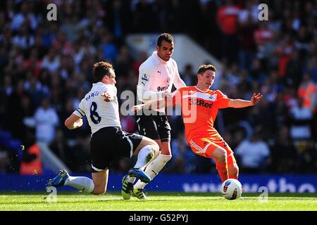 Swansea City's Joe Allen battles for the ball with Tottenham Hotspur's Scott Parker (left) and Raniere Sandro (centre) Stock Photo