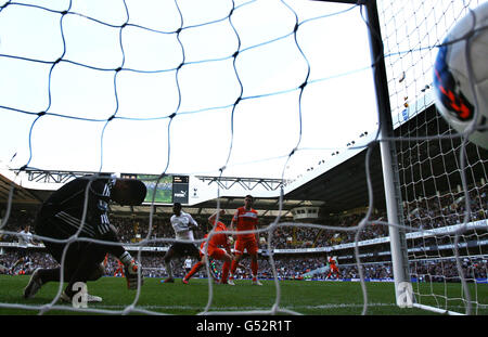 Soccer - Barclays Premier League - Tottenham Hotspur v Swansea City - White Hart Lane. Tottenham Hotspur's Emmanuel Adebayor scores his side's third goal during the Barclays Premier League match at White Hart Lane, London. Stock Photo