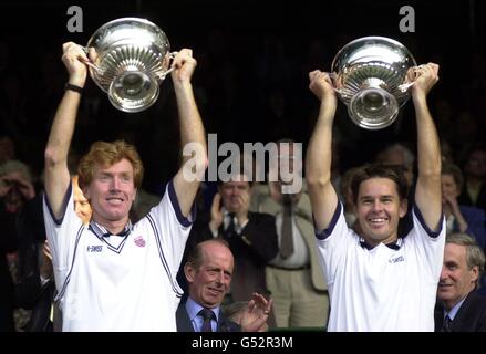 NO COMMERCIAL USE: Mark Woodforde (l) and Todd Woodbridge celebrate their 6/3 6/4 6/1 victory over Paul Haarhuis and Sandon Stolle in the final of the Gentlemen's Doubles at Wimbledon. Stock Photo