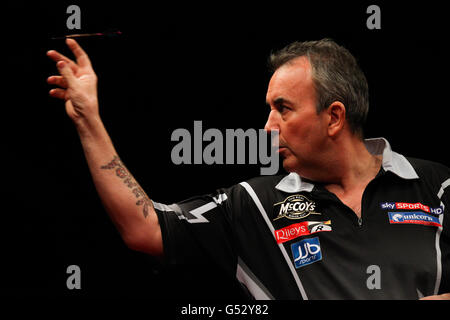 Darts - McCoys Premier League Darts - Capital FM Arena. Phil Taylor during his victory over Andy Hamilton Stock Photo