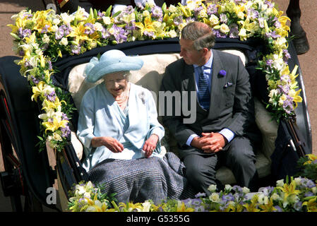 Queen Elizabeth The Queen Mother and Prince Charles arrive at Buckingham Palace during her birthday celebrations Friday 4. The Queen Mother turned 100 and travelled by horse-drawn carriage from Clarence House, her London residence. * along the Mall to Buckingham Palace. Stock Photo
