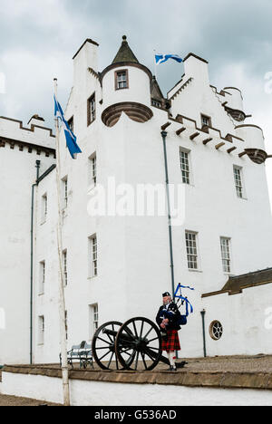 United Kingdom, Scotland, Perth and Kinross, Blair Atholl, bagpiper before Blair Castle, The castle was built in 1269 by John Comyn in Blair Atholl Stock Photo