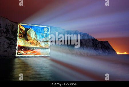 One of the new Royal Mail 1st class stamps celebrating UK landmarks is projected onto the White Cliffs of Dover, the gateway to Great Britain. Stock Photo