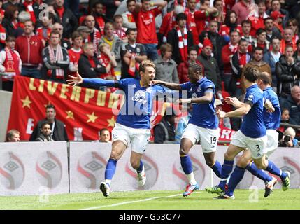 Everton's Nikica Jelavic (left) celebrates with team-mates after scoring his team's opening goal Stock Photo