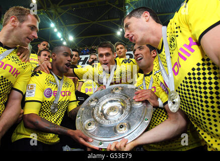 BVB Borussia Dortmund players with the league cup trophy, from left, Florian Kringe, Felipe Santana, Sebastian Kehl, Lucas Stock Photo