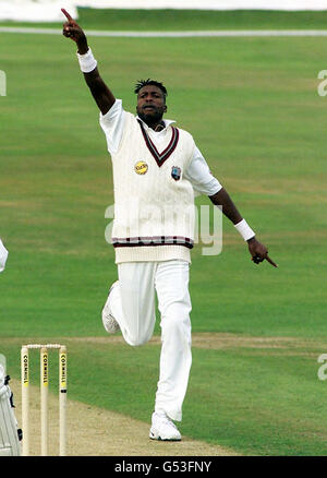 West Indian fast bowler Curtly Ambrose celebrates the wicket of England opener Mike Atherton during the first day of the Fourth Cornhill Test at Headingley in Leeds. This wicket takes his Test taking tally to 400. Stock Photo