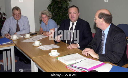 Senior agriculture ministers at a meeting with pig industry representitives to discuss the outbreak of swine fever. Mr Brown has pledged to keep the British pig industry under tight control in a bid to prevent the spread of swine fever. * and persuade the EU to lift its export ban. L-R: Ministry of Agriculture, Fisheries and Food (MAFF) Senior official Robert Bell, Junior Agriculture Minister Baroness Hayman, the Secretary of State for Agriculture Nick Brown, and Chief Vet Jim Scudamore, Stock Photo