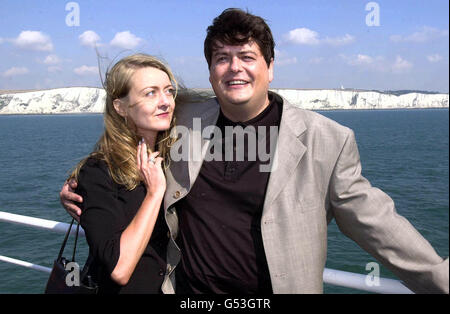 Former MI5 employee David Shayler and his girlfriend Annie Machon, with the White Cliffs of Dover in the background, arrive at the Kent port, where he was arrested. *The renegade secret agent is claiming victory in his battle against the Government and security services on his return to Britain to face charges under the Official Secrets Act. The former MI5 intelligence officer claimed the Metropolitan Police Service was investigating his allegations that MI6 was behind a plot to assassinate Libyan leader Colonel Gaddafi that left several civilians dead. 04/11/02 Former MI5 officer David Stock Photo