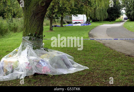 A plastic sheet protects flowers left by friends and family at the scene where the body of 17-year-old Heather Tell was discovered in bushes off a footpath leading to the A5 in Kettlebrook Linear Park, Tamworth, Staffordshire. * Detectives are continuing their hunt for the killer of the teenager whose body was found yards from the spot where she was due to meet a friend. Heather, who was studying for a BTec in performing arts at Sutton College in Sutton Coldfield, West Midlands, lived with her father, Peter, a self-employed printer, and 18-year-old sister in Lowforce, Stonydelph, Tamworth. Stock Photo