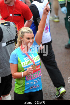 Athletics - 32nd Virgin London Marathon. Billi Mucklow from the television programme The Only Way Is Essex finishes the 32nd Virgin London Marathon in London. Stock Photo