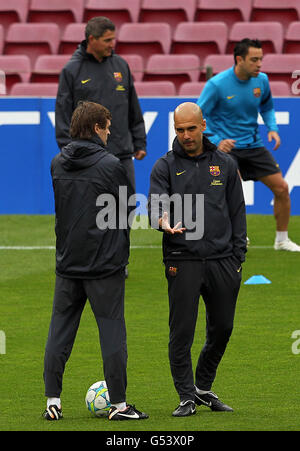 Head coach Pep Guardiola, right, interacts with Jason Denayer of ...