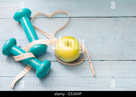 Fitness and diet abstract concept with dumbbells closeup Stock Photo