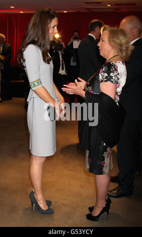 The Duchess of Cambridge meets Deborah Meaden (right) as she arrives at the African Cats UK film premiere held at the BFI Southbank, London. Stock Photo