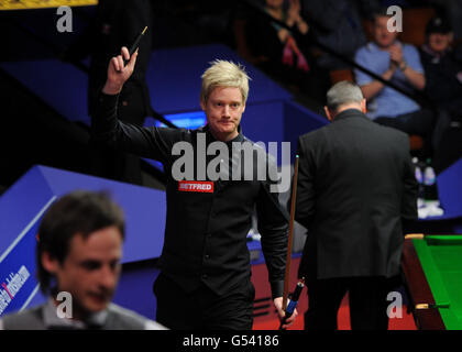 Australia's Neil Robertson waves to the crowd as he walks off after winning his second round match against England's David Gilbert during the Betfred.com World Snooker Championships at the Crucible Theatre, Sheffield. Stock Photo