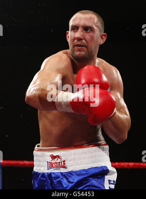 Jon Lewis Dickinson in action against Matty Askin during their Cruiserweight bout at the Sports Centre, Oldham. Stock Photo