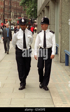 Two Metopolitan Police constables on patrol in central London. Police officers patrolling alone rather than in pairs could become the norm under plans for a major shake-up aimed at creating a greater police presence in the community. * The annual conference of the Police Superintendents' Association will hear a number of controversial measures which could sweep away many existing police practices. Stock Photo