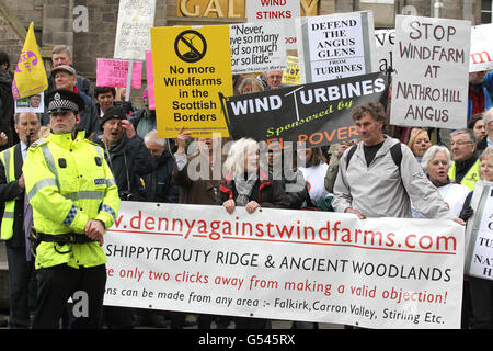 Anti-Wind power protesters at the Scottish Parliament in Edinburgh as Donald Trump gives evidence to the Scottish Parliament's Economy, Energy and Tourism Committee this morning. Stock Photo