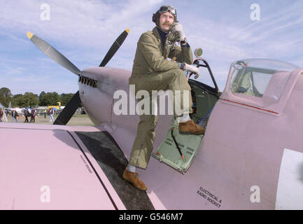 Flight Lieutenant Charlie Brown of the RAF at the cockpit of his Supermarine Spitfire MK11, which is painted pink for its job as a reconnaissance aircraft, at the Battle of Britain Air Show at Duxford near Cambridge. * The largest single formation of Spitfires seen over Britain since the end of the Second World War was due to take to the skies over the former World War II fighter base, as the highlight of a show celebrating the 60th anniversary of the battle. Stock Photo