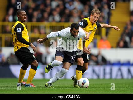 Tottenham Hotspur's Raniere Sandro (centre) and Blackburn Rovers' Morten Gamst Pedersen (right) battle for the ball Stock Photo