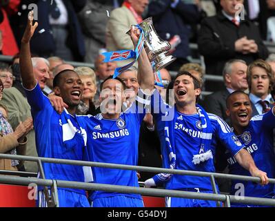 Soccer - FA Cup - Final - Liverpool v Chelsea - Wembley Stadium. Chelsea's John Terry (centre), Frank Lampard (right) and Didier Drogba (left) celebrate winning the FA Cup Stock Photo