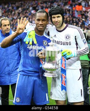 Chelsea's Didier Drogba and goalkeeper Petr Cech celebrate victory with the trophy, after the final whistle Stock Photo