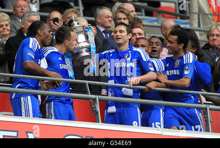 Chelsea's Didier Drogba, John Terry, Frank Lampard, Florent Malouda, Salomon Kalou and Jose Bosingwa (left to right) celebrate with the FA Cup after victory over Liverpool Stock Photo