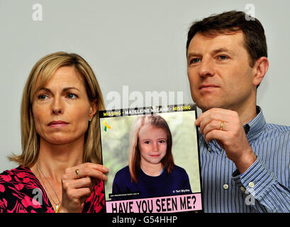 Gerry and Kate McCann whose daughter Madeline disappeared from a holiday flat in Portugal five years ago tomorrow, talk to the media at a press conference in London where they hold an image of what Madeline might look like today. Stock Photo