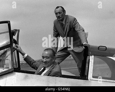 WARTIME FIGHTER PILOTS: The meeting at North Weald Airfield between legendary ace fighter pilots of the Second World War, Britain's RAF Wing Commander Bob Stanford-Tuck (r) and former Luftwaffe General Adolf Galland, seated in a Messerschmidt aircraft. Galland, commander of JG26, was also one of the founding fathers of the post-war German Luftwaffe. Stock Photo