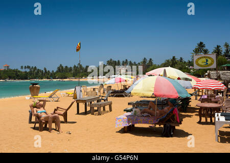Sri Lanka, Galle Province, Unawatuna beach, tourists sunbathing Stock Photo