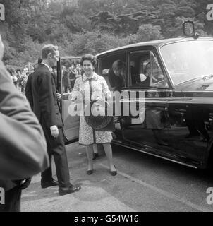 Queen Elizabeth II, followed by Prince Andrew, at Windsor and Eton railway station. Stock Photo