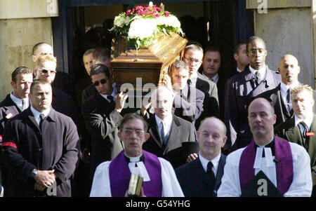 The coffin leaves St Matthew's Church, Bethnal Green, London at Reggie Kray's funeral. The gangland killer died a month after being freed from a life prison sentence on compassionate grounds and 10 days after leaving the Norfolk & Norwich hospital. *... After a service at St Matthew's Church, Tower Hamlets, he will be buried in the family plot at Chingford Mount Cemetery alongside his brother Ronnie and Charlie. The Krays' gang, The Firm, had a Mafia-style grip on London's East End in the 1960s. Stock Photo