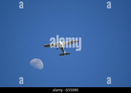 Turkish Air Association-THK's Cessna 172S trainer aircraft and half moon over the Beynam Forest Stock Photo