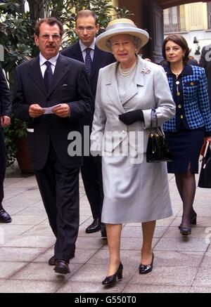 Britain's Queen Elizabeth II is flanked by Francesco Morelli, director of the Institute and followed by Italian Industry minister Enrico Letta, centre, during a visit to the European Institute of Design, in Milan. *...The Queen, who is finishing a four day official visit to Italy, travelled to Milan, from Rome, for her first trip to Italy's financial capital in 39 years. Stock Photo