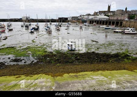 Fishing boats in Penzance harbour at low ttide Stock Photo