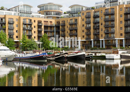 View of St Katherine dock marina in Tower Hamlets London. Once a commercial dock now home to waterside homes and dining. Stock Photo