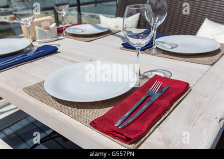 decorated table in the open air in the summer Stock Photo