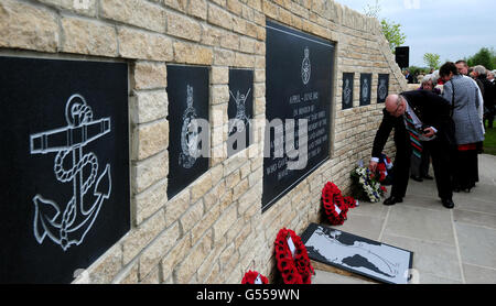 Wreaths are laid at the new memorial commemorating the 255 British servicemen who died in the Falklands War, unveiled at the National Memorial Arboretum in Staffordshire. Stock Photo