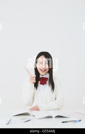 Japanese High-school student in uniform against white background Stock Photo