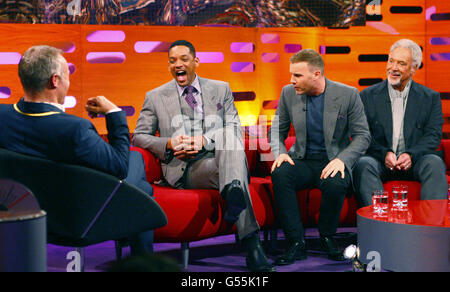 Graham Norton (left) interviews guests (left to right) Will Smith, Gary Barlow and Tom Jones during the filming for this week's edition of The Graham Norton Show, at the London Studios in London. Stock Photo