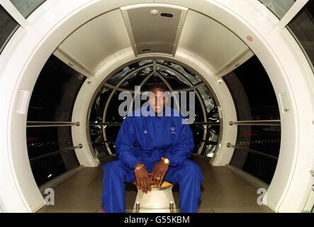 Olympic heavyweight gold medal boxer Audley Harrison inside a capsule on the London Eye, during the official British Olympic Society's celebration party of our teams successes in Sydney 2000. Stock Photo