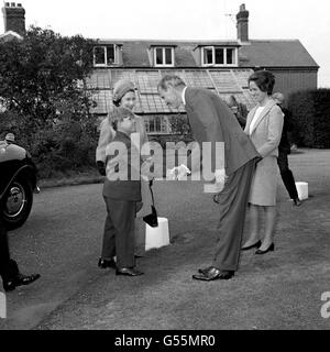 Eight year old Prince Andrew, the future Duke of York, and his mother Queen Elizabeth II (left, background), are greeted on arrival at Heatherdown Preparatory School, Ascot, in Berkshire, by headmaster James Edwards and Elizabeth Keeling, twin sister of the headmaster's wife. Stock Photo