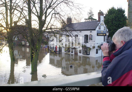 Flooded scene around The Plough Inn at Upton upon Severn, Worcestershire. Flood-hit Britain was set for further misery as forecasters predicted . *more bad weather was on the way. An estimated 3,000 homes have now been swamped and the torrent of water is on the same scale as the 'Great Floods of 1947', said the Environment Agency. The agency has issued 11 severe flood warnings along the River Severn and on five other rivers in Yorkshire and Wales. Stock Photo