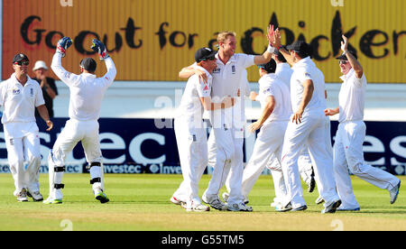England's Stuart Broad celebrates after bowling West Indies Shivnarine Chanderpaul caught by Jonathan Trott for11 runs during the second test match at Trent Bridge, Nottingham. Stock Photo