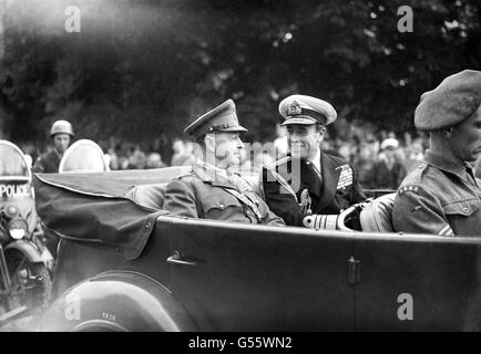 Admiral Lord Louis Mountbatten, Supreme Allied Commander, South East Asia and Field Marshal Viscount Alexander of Tunis, Governor General of Canada riding in an Army vehicle at the head of the mechanised Column. Stock Photo