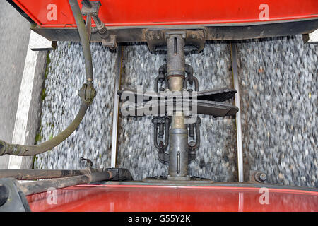 Railway coupling on vintage train in movement, view from above Stock Photo