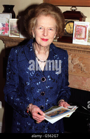 Former British Prime Minister Baroness Thatcher puts her birthday cards on the mantlepiece in her London office. Lady Thatcher is 75. Stock Photo